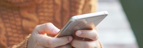 im768x260-contact-us-close-up-customer-using-mobile-phone