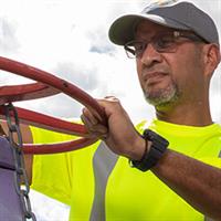 careers-male-utility-field-employee-operating-large-valve