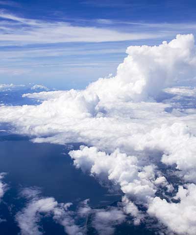Deep blue sky and cumulous clouds from an aircraft.