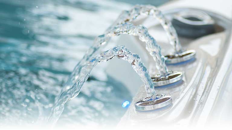 Close-up of jets of water on a hot tub.