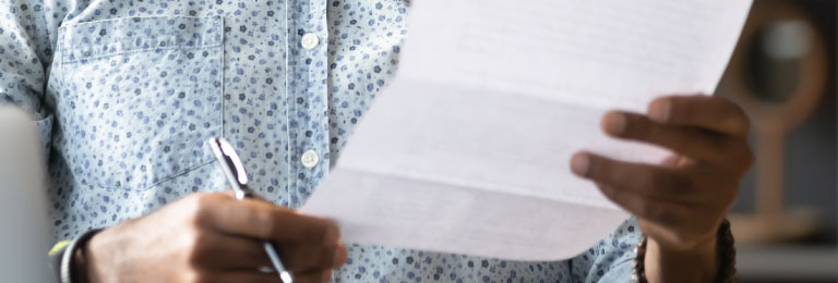 im768x260-my-bill-man-looking-at-paper-bill